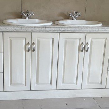 A bespoke bathroom vanity unit, solid timber painted white