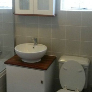 Modern bathroom vanity in pine with a Kiaat top