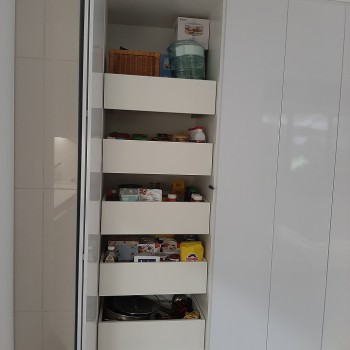 High gloss supawood grocery cupboard with bifold doors and pull out drawers